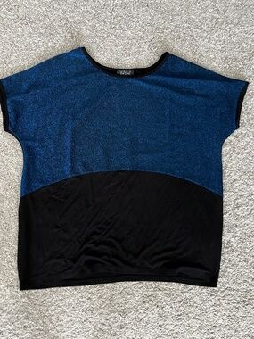 Sparkly blue and black color-blocked top. New w/o tag. Size M. Relaxed fit.